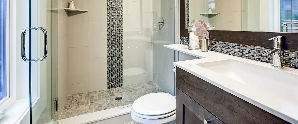 A bathroom renovation cost in Vaughan with glass-shower and brown vanity
