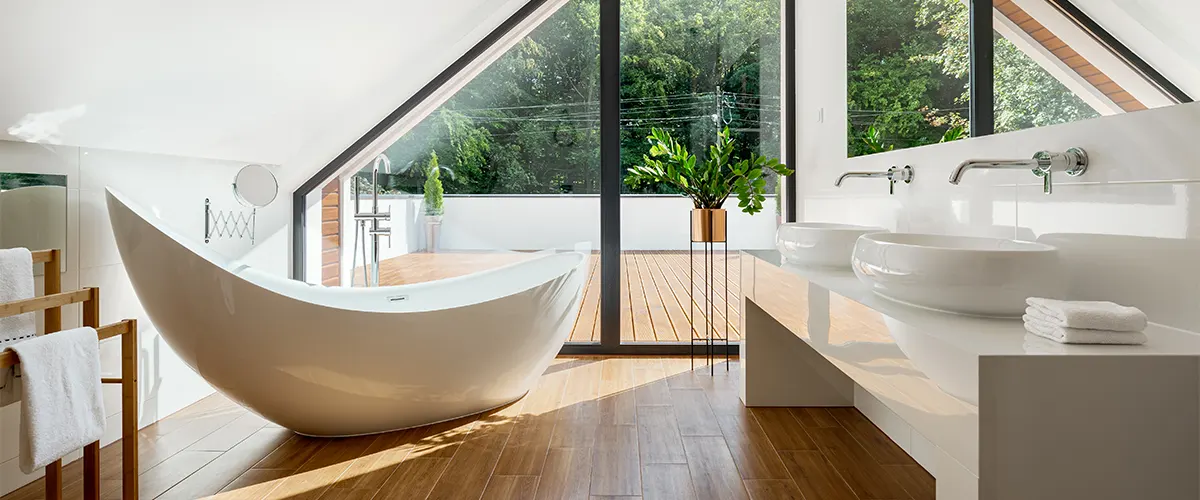 A bathroom renovation in Toronto with a free standing tub in a cozy space