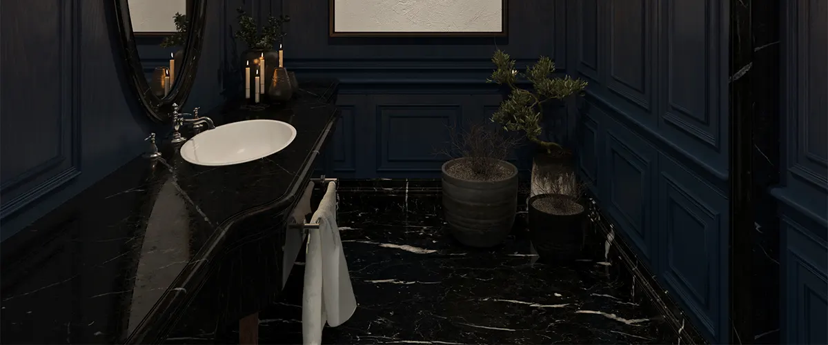 A powder room with dark floor and blue walls