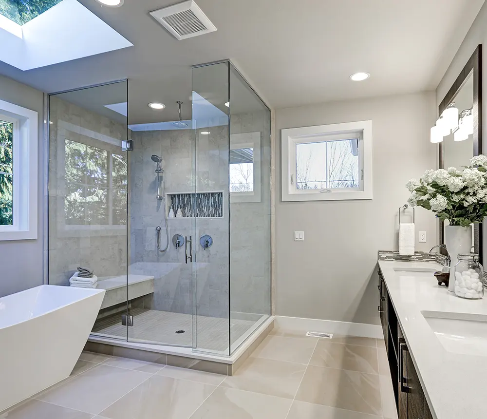 Bathroom renovation with large glass shower and freestanding tub