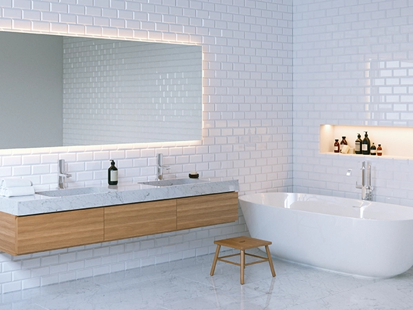 A white bathroom with marble flooring