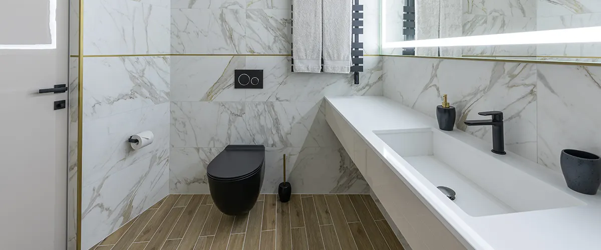 golden grout lines and black toilet