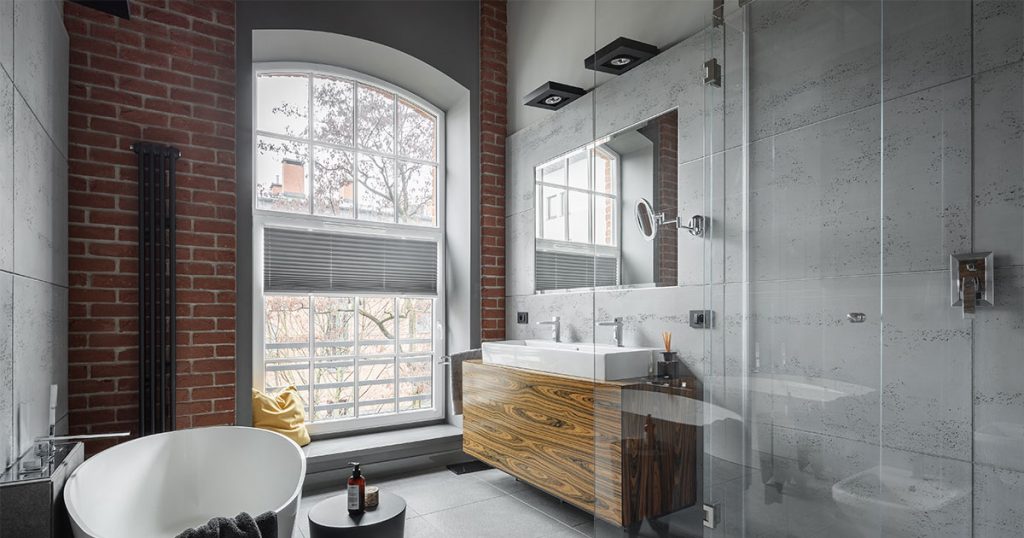 Bathroom with frameless glass shower