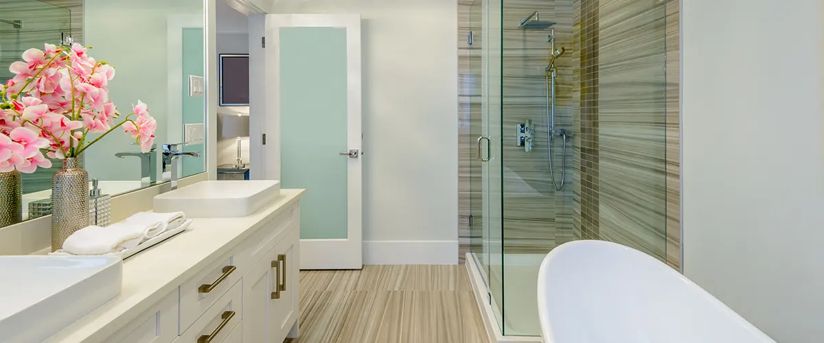 A bathroom with pink flowers and LVT flooring