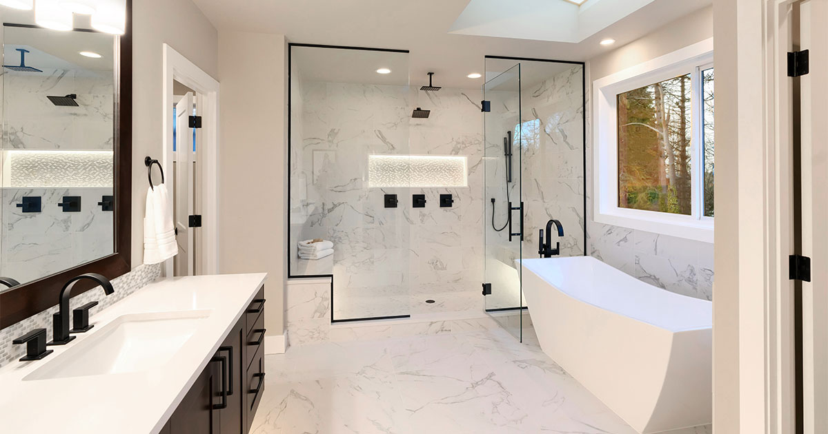 A white bathroom with dark color accents