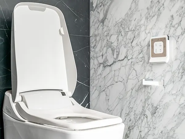 A fancy toilet with gadgets