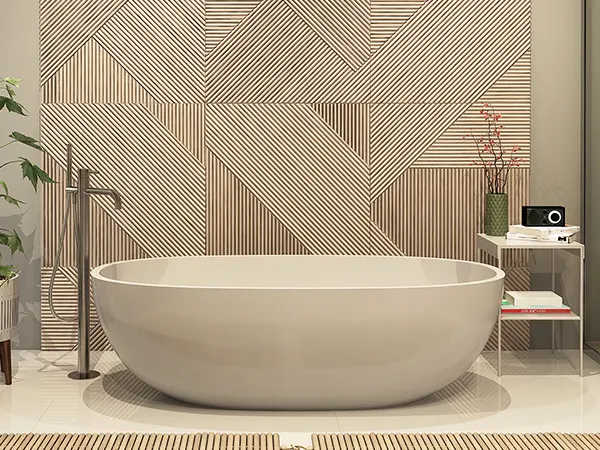 A bathtub in a bath with different patterns on walls
