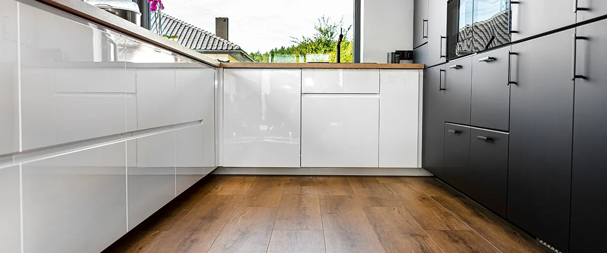 Vinyl flooring with modern white cabinets without any hardware