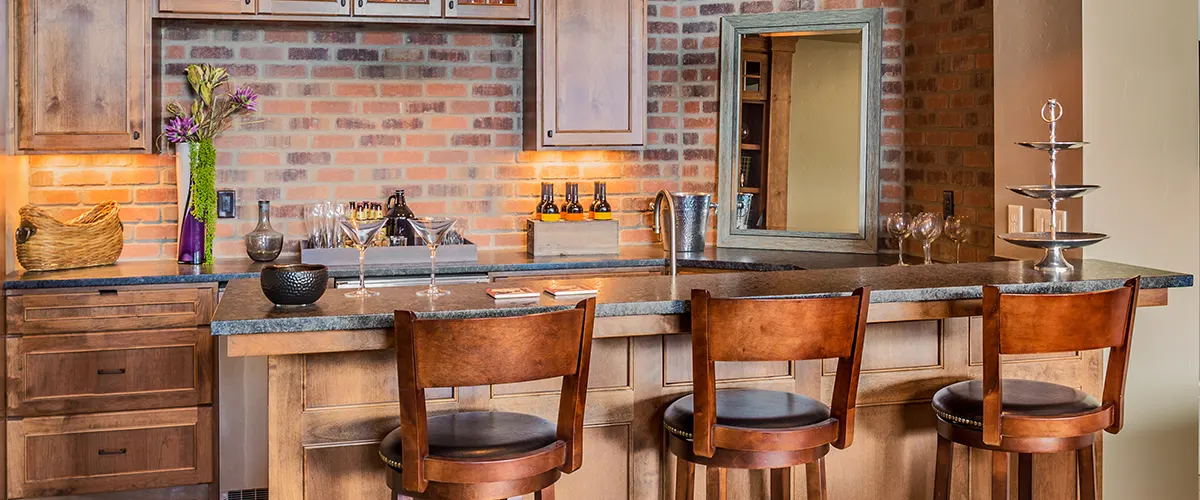 An eco-friendly kitchen with wood chairs and cabinets