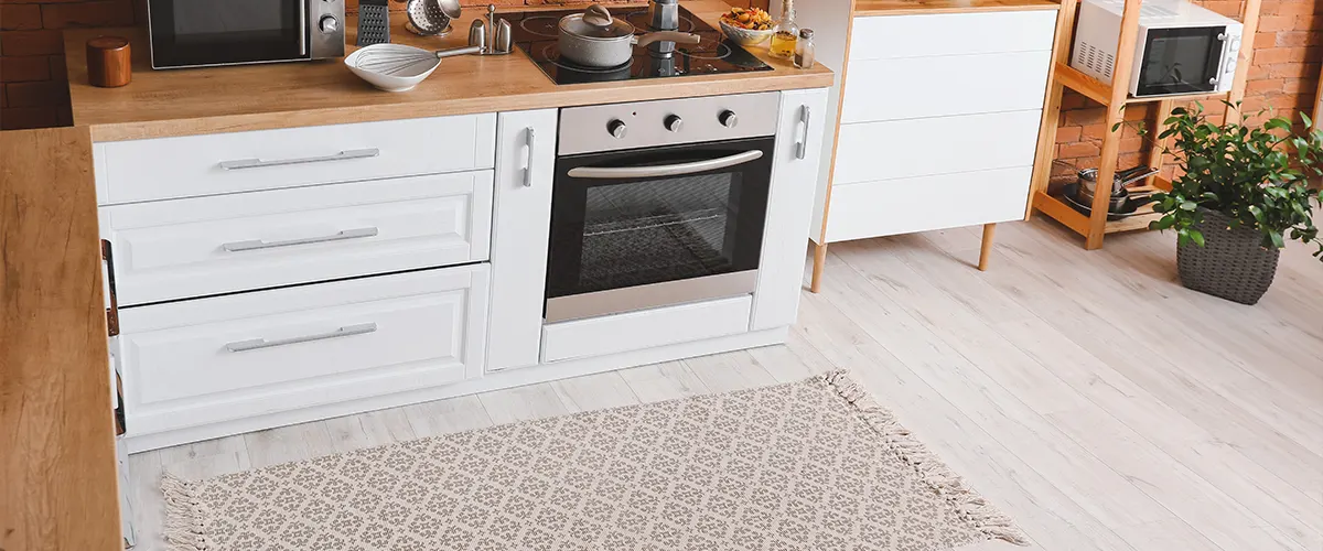 A floating floor in a kitchen with butcher block countertop