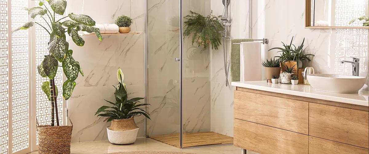 A beautiful organic bathroom with plants and wood accents