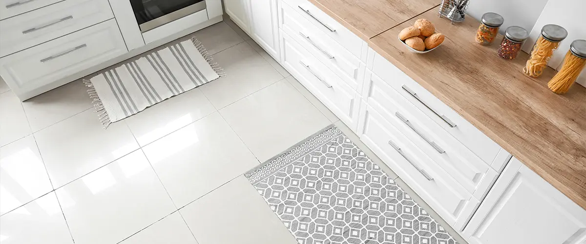 A white porcelain tile flooring with carpets