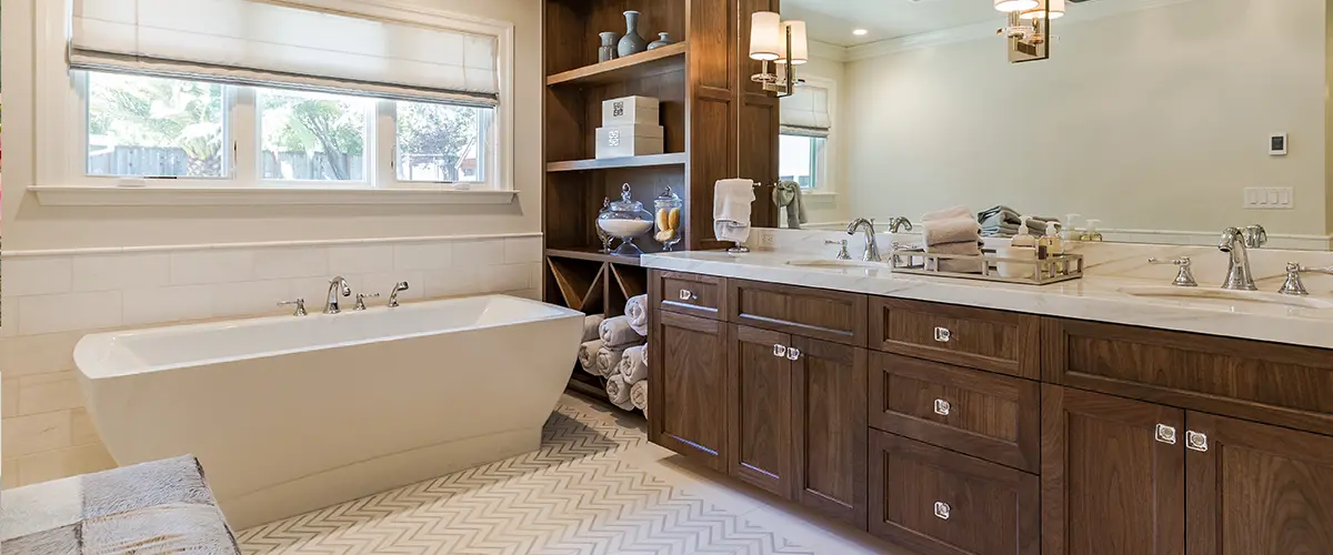A bathroom renovation cost in Brampton with a wood double vanity and large tub