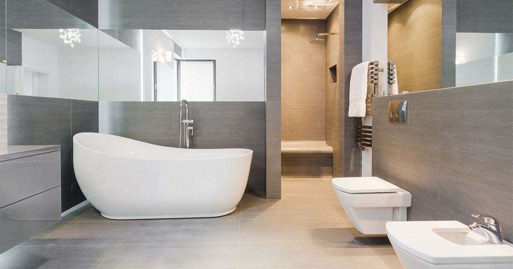 A beautiful bath style with gray walls and floor