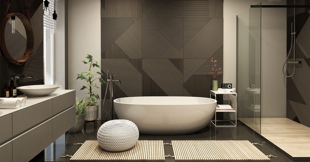A beautiful bathroom with black patterns on walls and a freestanding tub