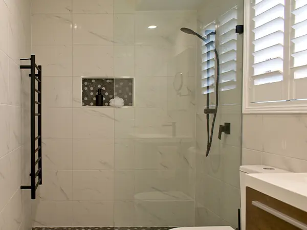 Glass shower with black shower head