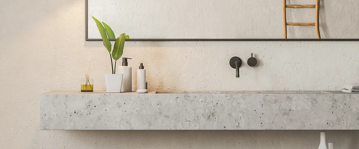 Concrete countertop with large rectangular mirror