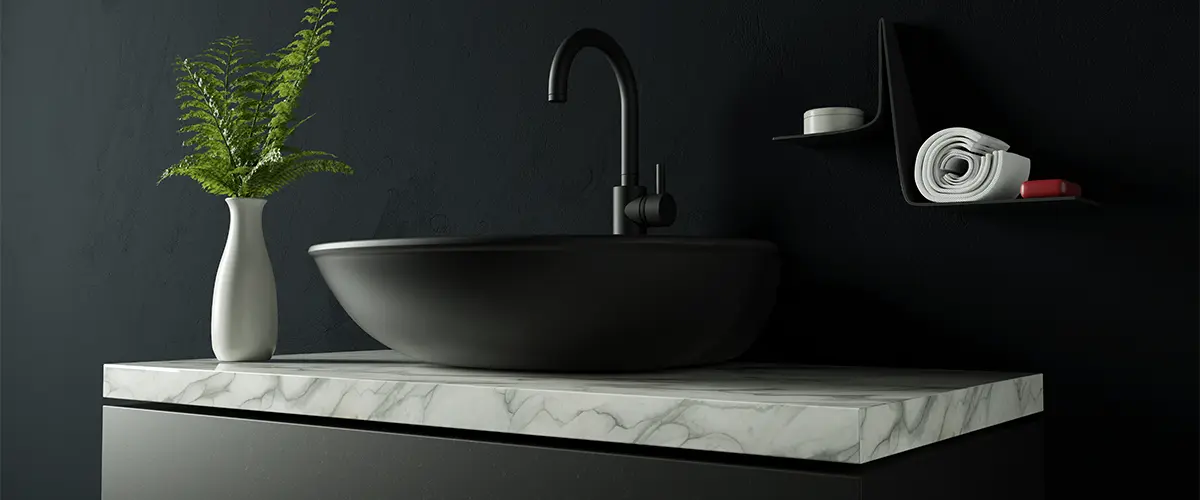 Quartz countertop with black walls and black sink