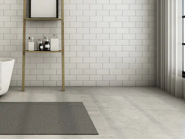 Concrete floor in bath with carpet