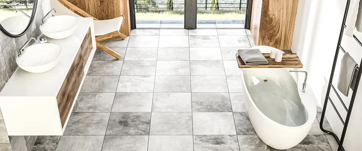 Beautiful bath with large tile floor in a gray hue
