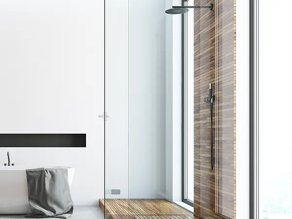 A glass shower with wood features