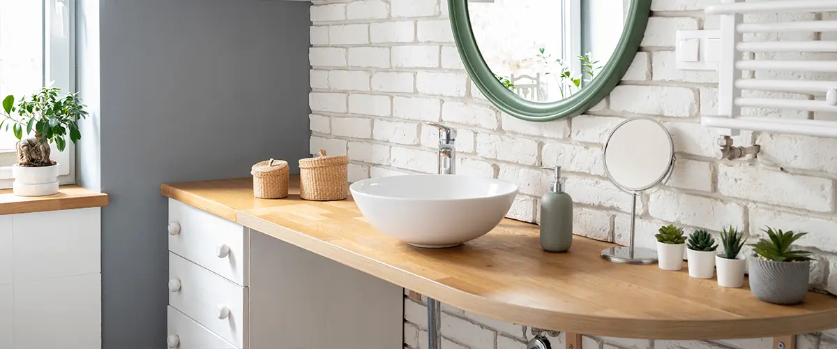 Wood countertop for a bathroom with brick backsplash