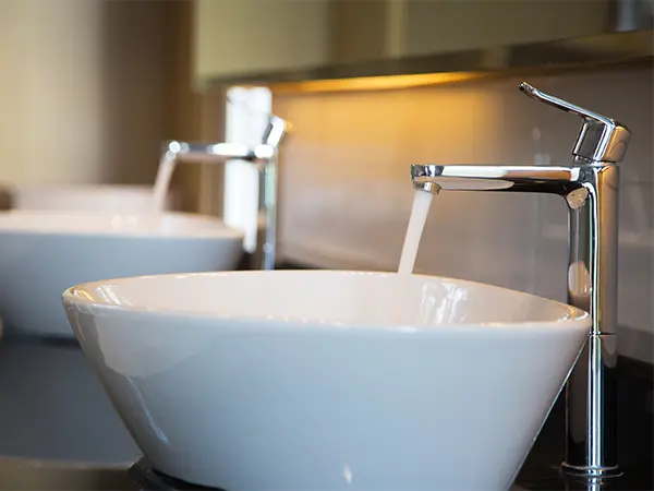 Vessel sinks with silver faucets